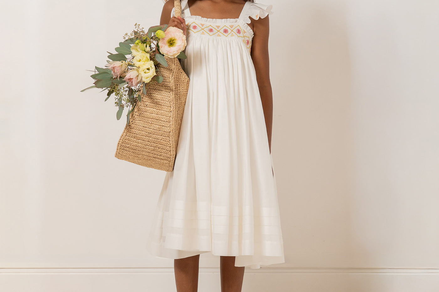 Girl's Look Summer 2026 - Smocked and hand-embroidered dress in organic cotton