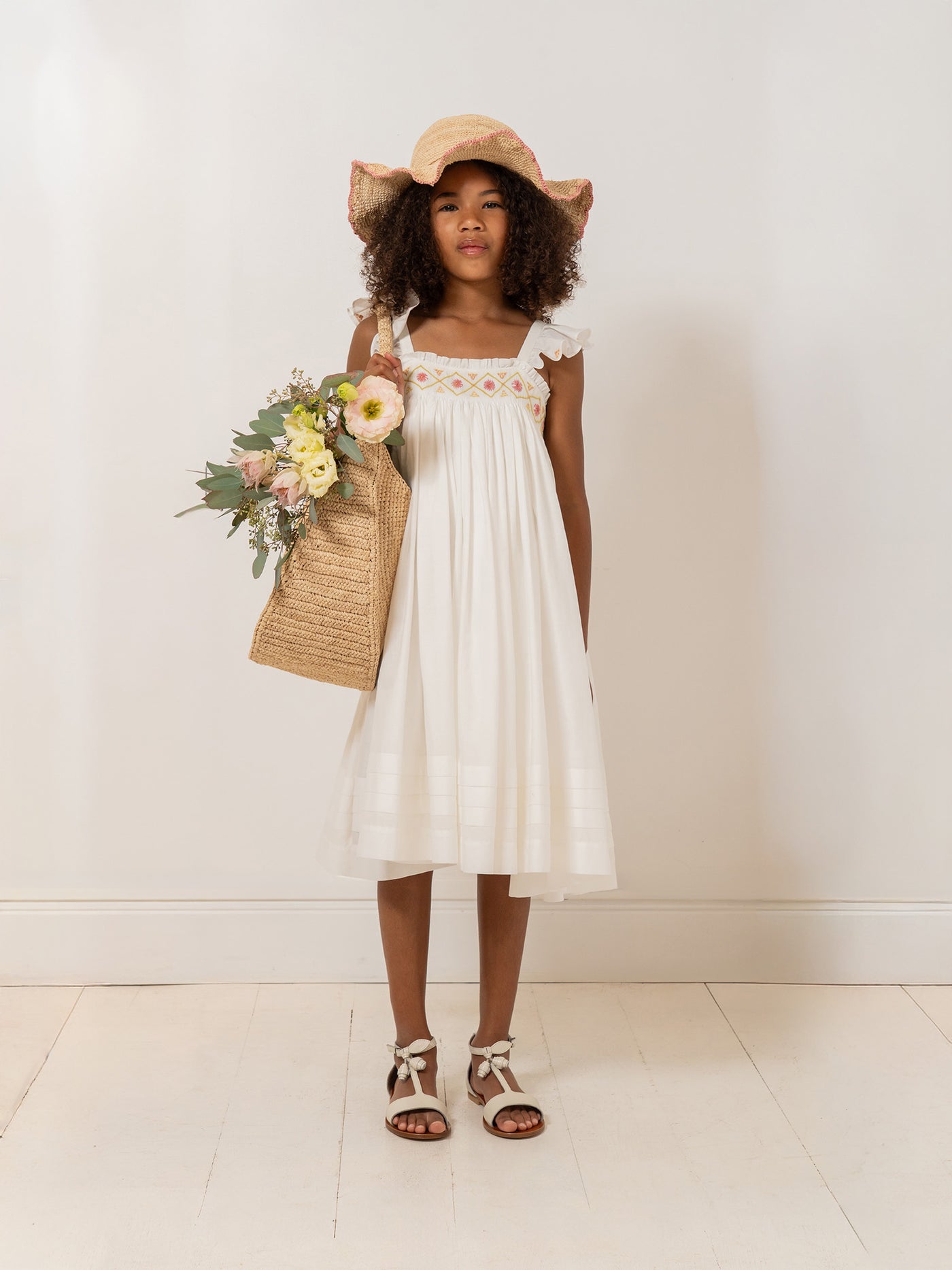 Girl's Look Summer 2026 - Smocked and hand-embroidered dress in organic cotton