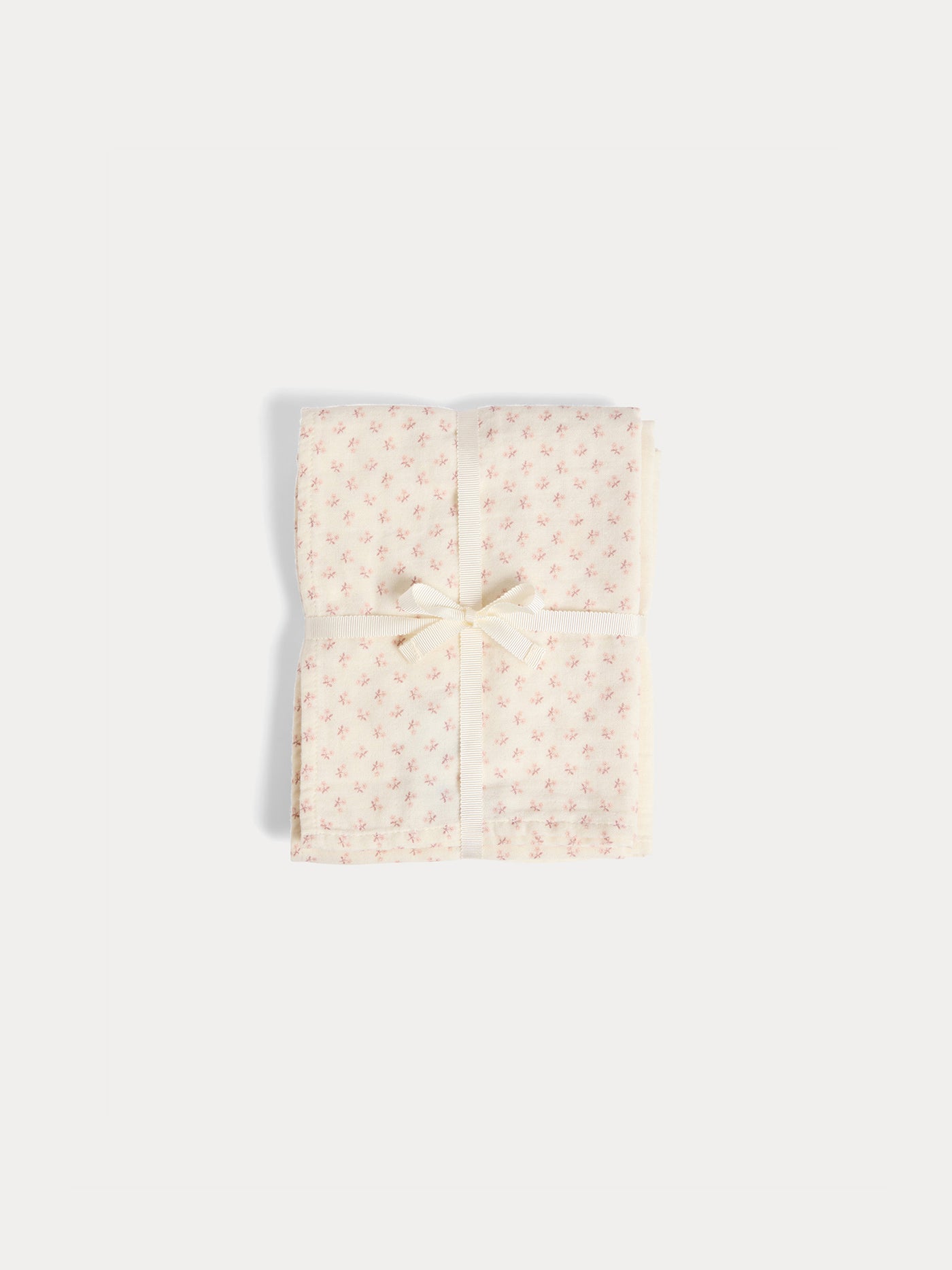Set of plain and floral print cuddly swaddles in organic cotton