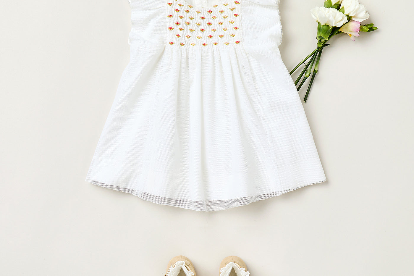 Summer 2025 Baby girl's look - White dress with embroidered smocks
