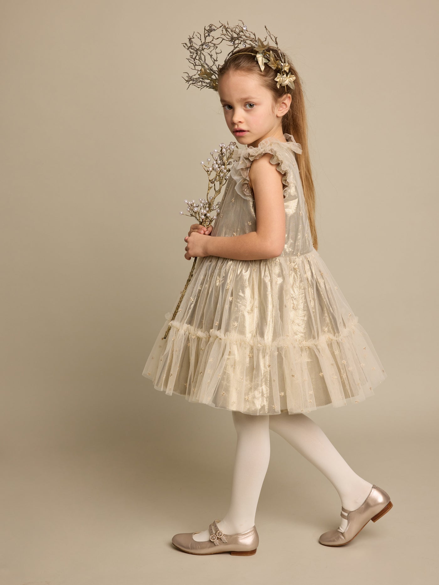 Winter 2023 girl's look golden dress