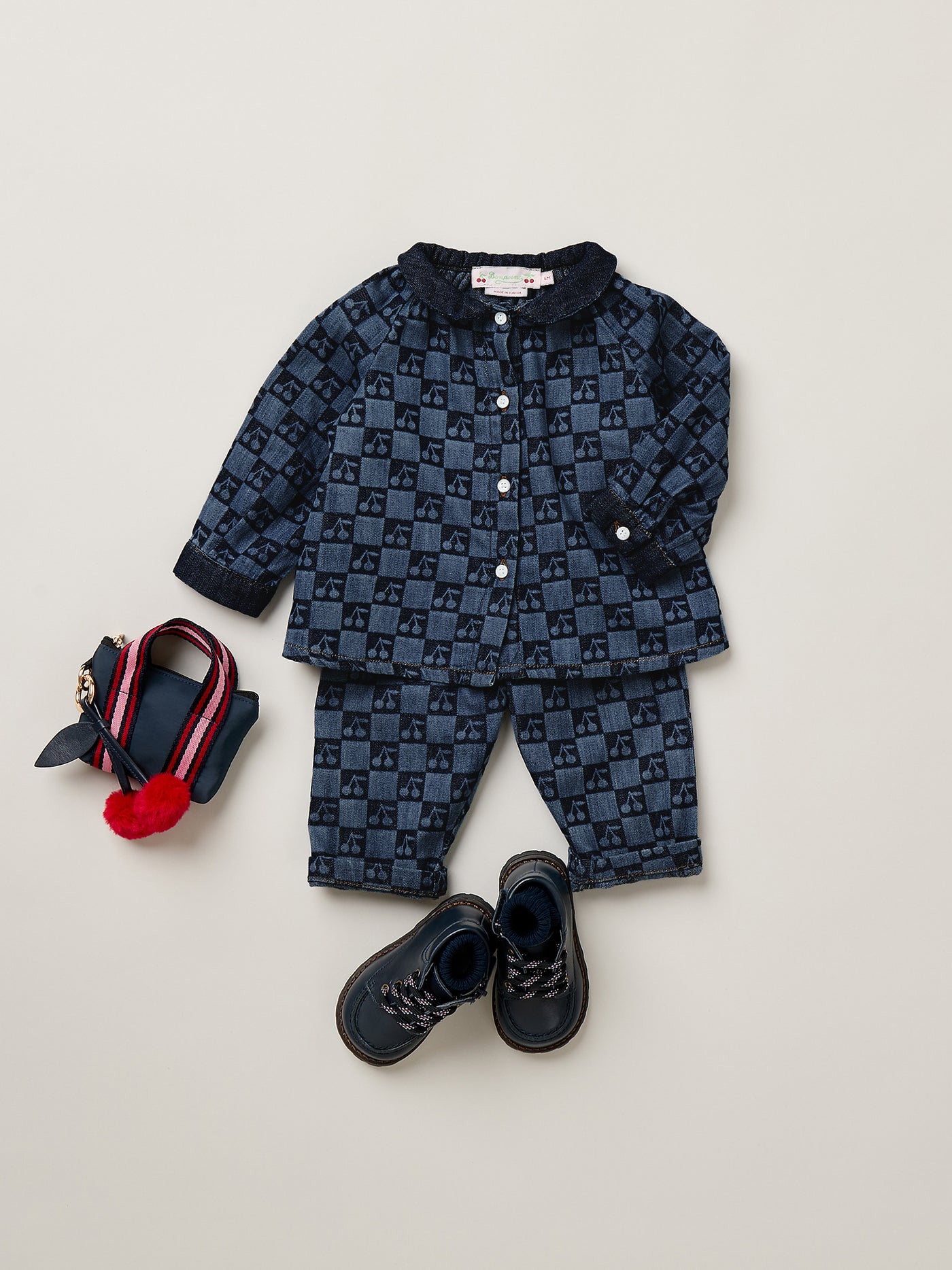 Momino baby blouse with a Peter Pan collar featuring a cherry chequered print in organic cotton