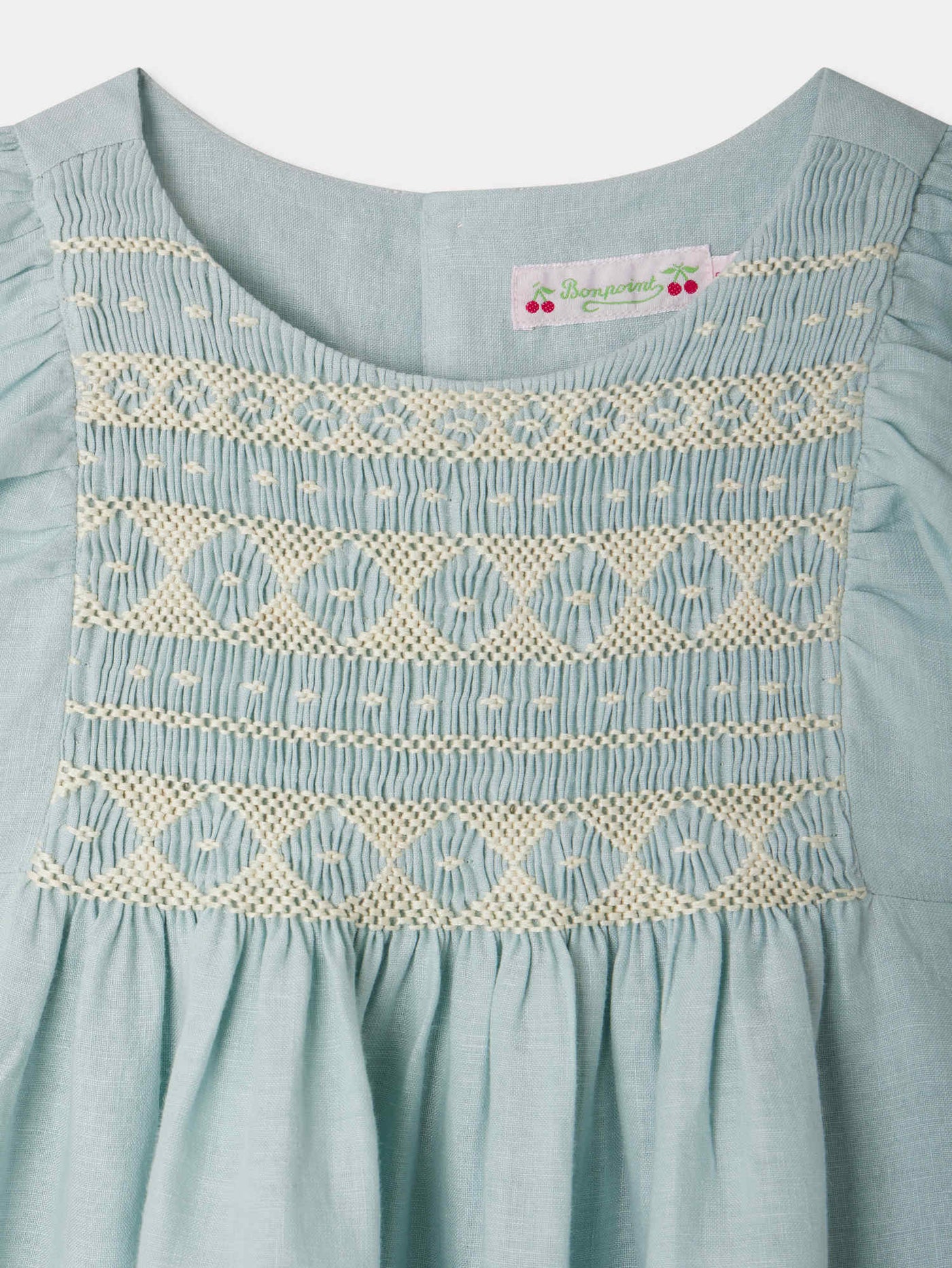 Emerald smocked and embroidered linen dress