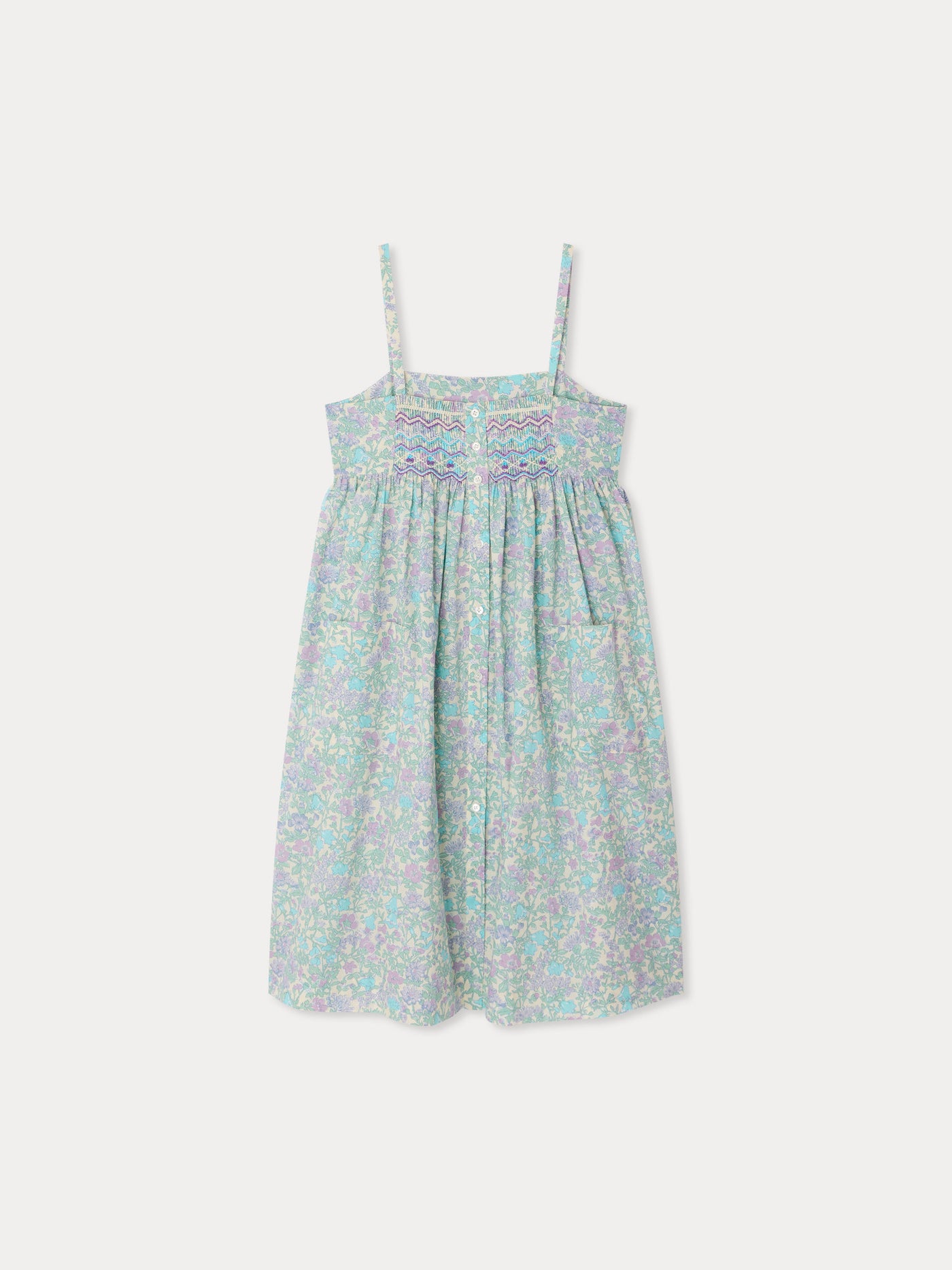 Passion dress smocked and embroidered in Liberty fabric in organic cotton
