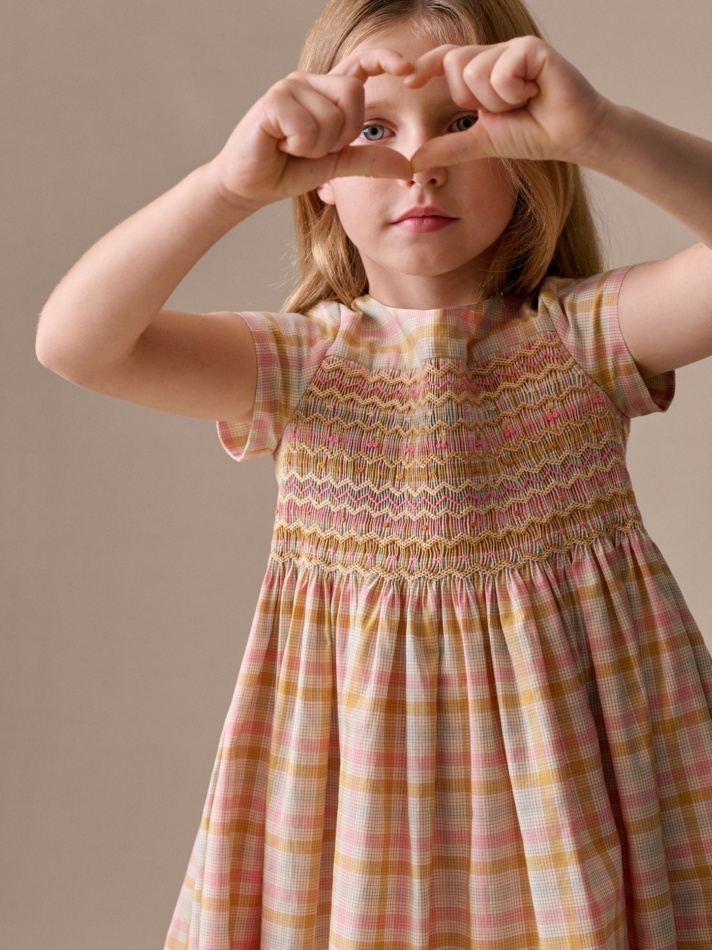 Duchesse dress in a smocked hand-embroidered check pattern in organic cotton