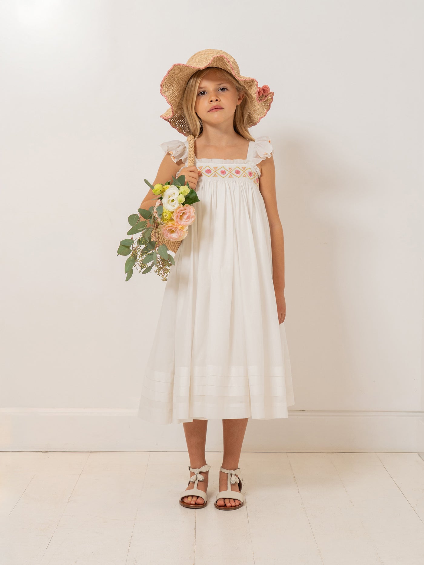 Laora dress smocked and hand-embroidered in organic cotton