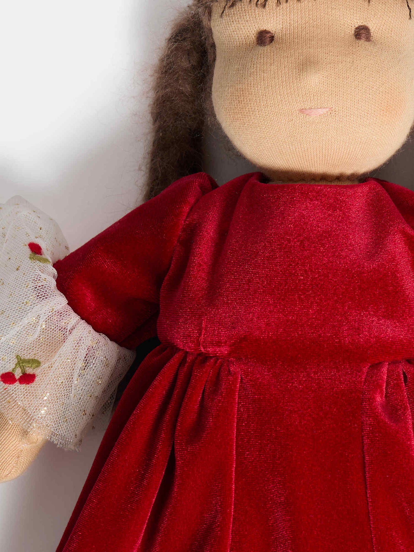 Maelys doll dressed in velvet dress