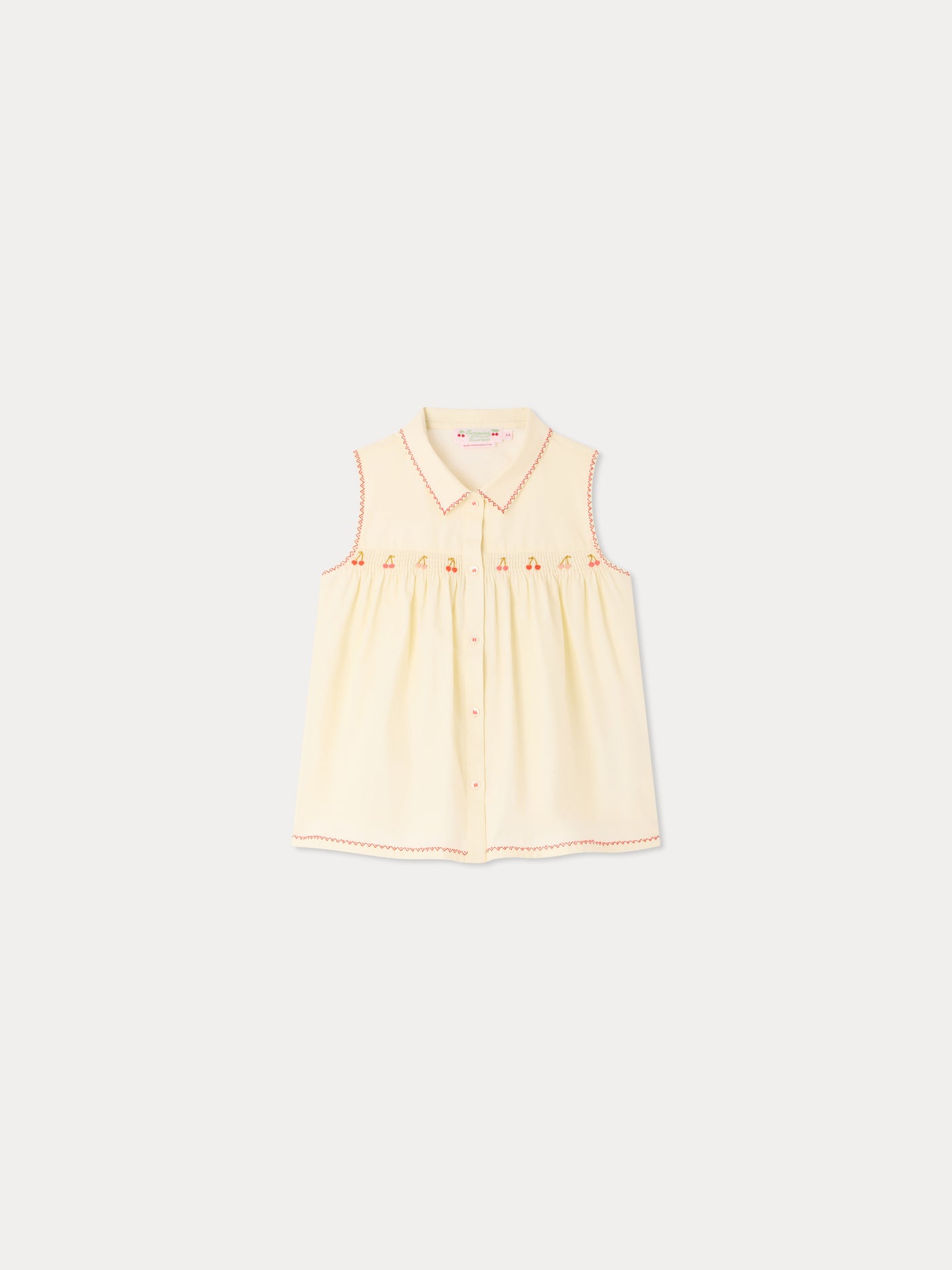 Lexi smocked and hand-embroidered blouse in organic cotton
