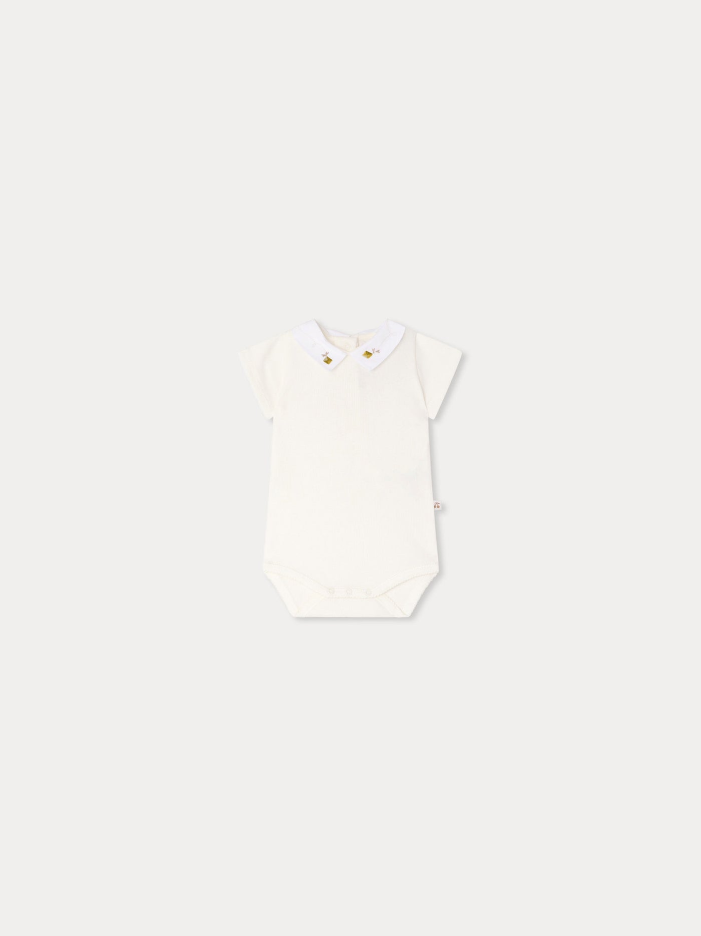 Juillet bodysuit with hand-embroidered kites in organic cotton