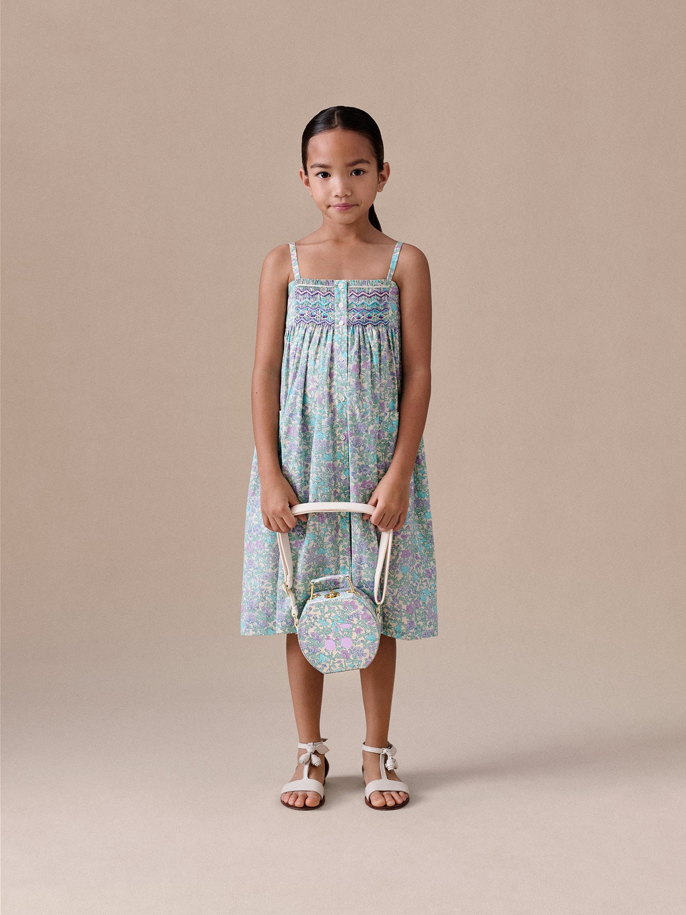 Passion dress smocked and embroidered in Liberty fabric in organic cotton