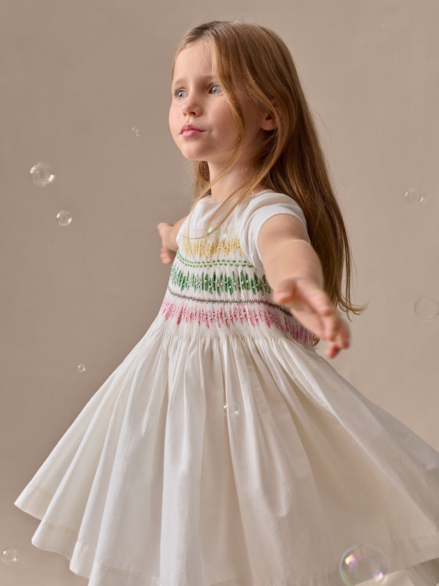 Tie-dye smocked and hand-embroidered Duchesse dress in organic cotton