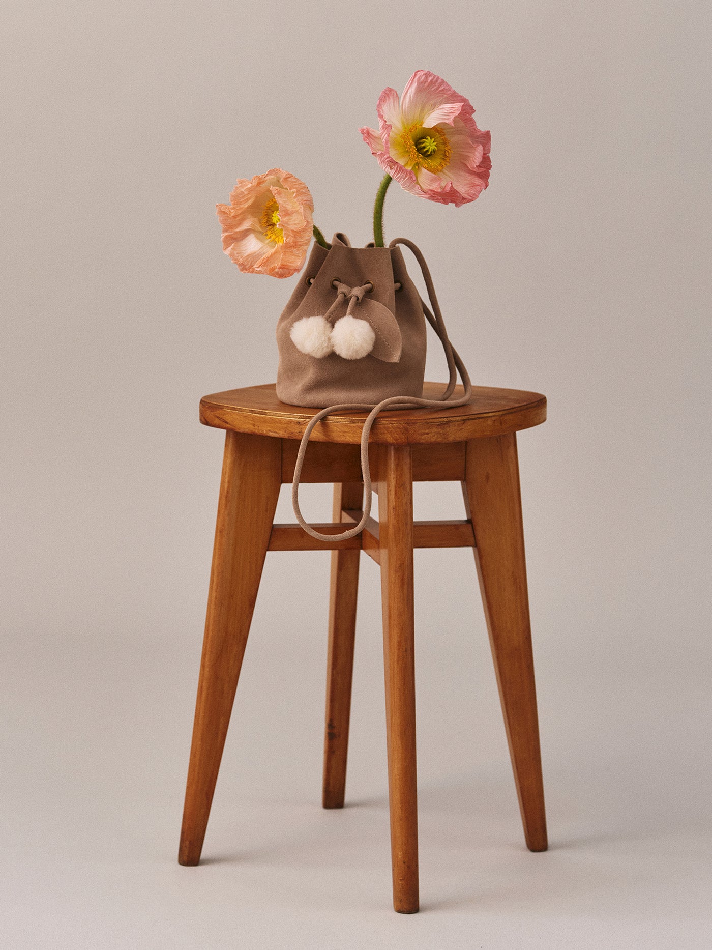 Jessika bag in suede leather and faux fur pompom