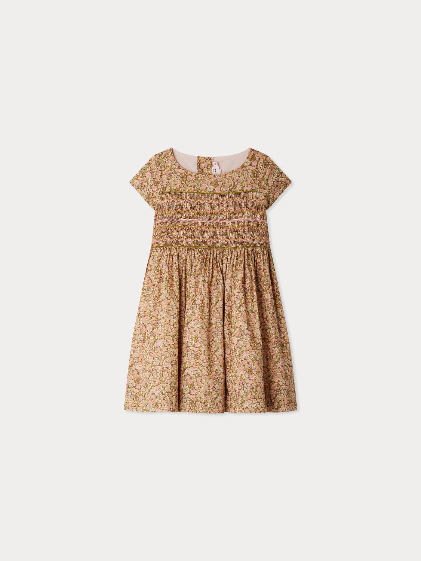 Smocked and embroidered Duchesse dress in Liberty fabric in organic cotton