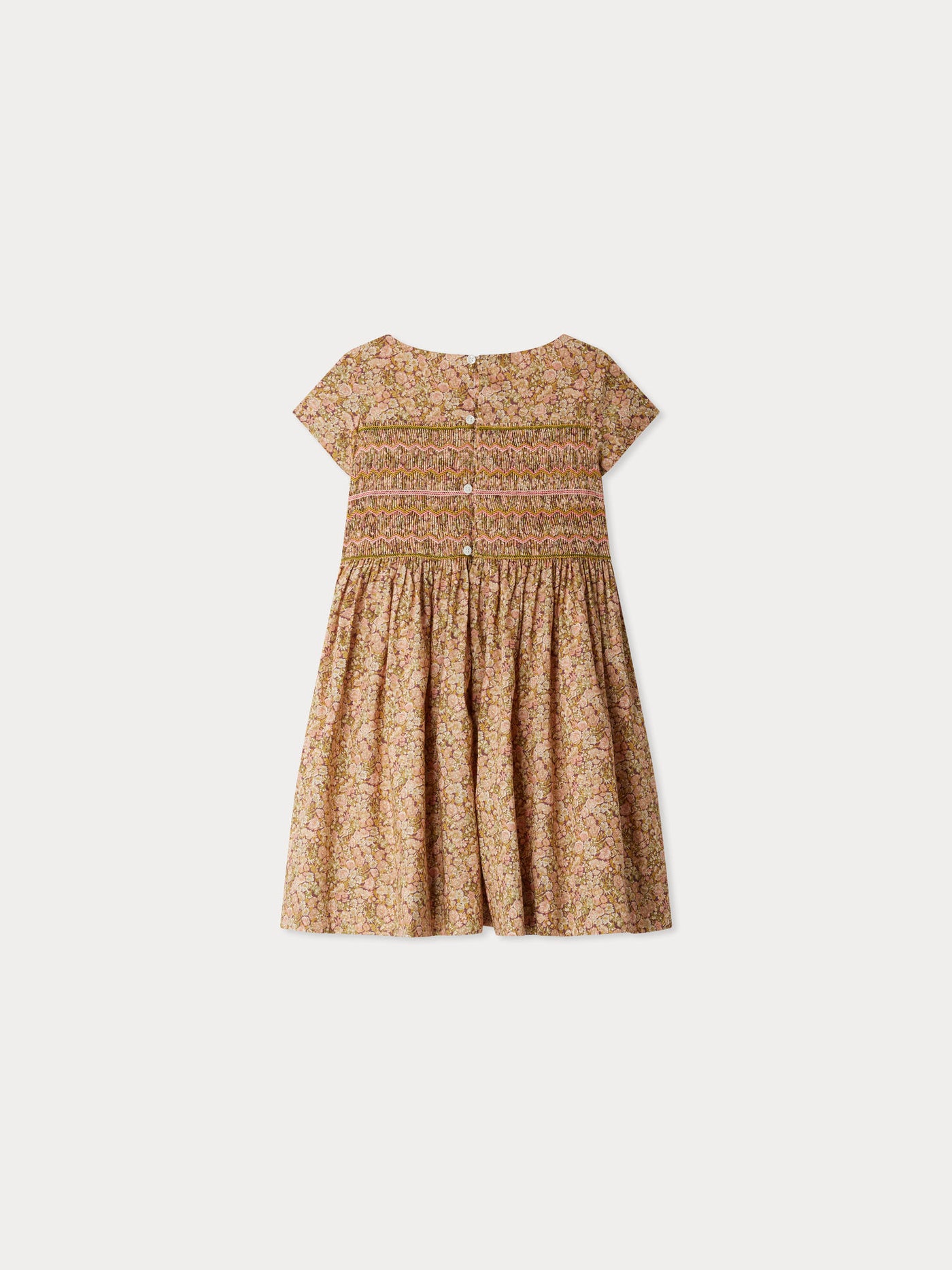 Smocked and embroidered Duchesse dress in Liberty fabric in organic cotton