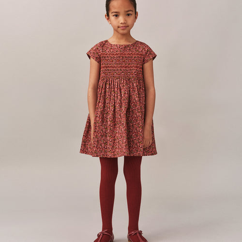 Smocked and embroidered Duchess dress in Liberty fabric in organic cotton