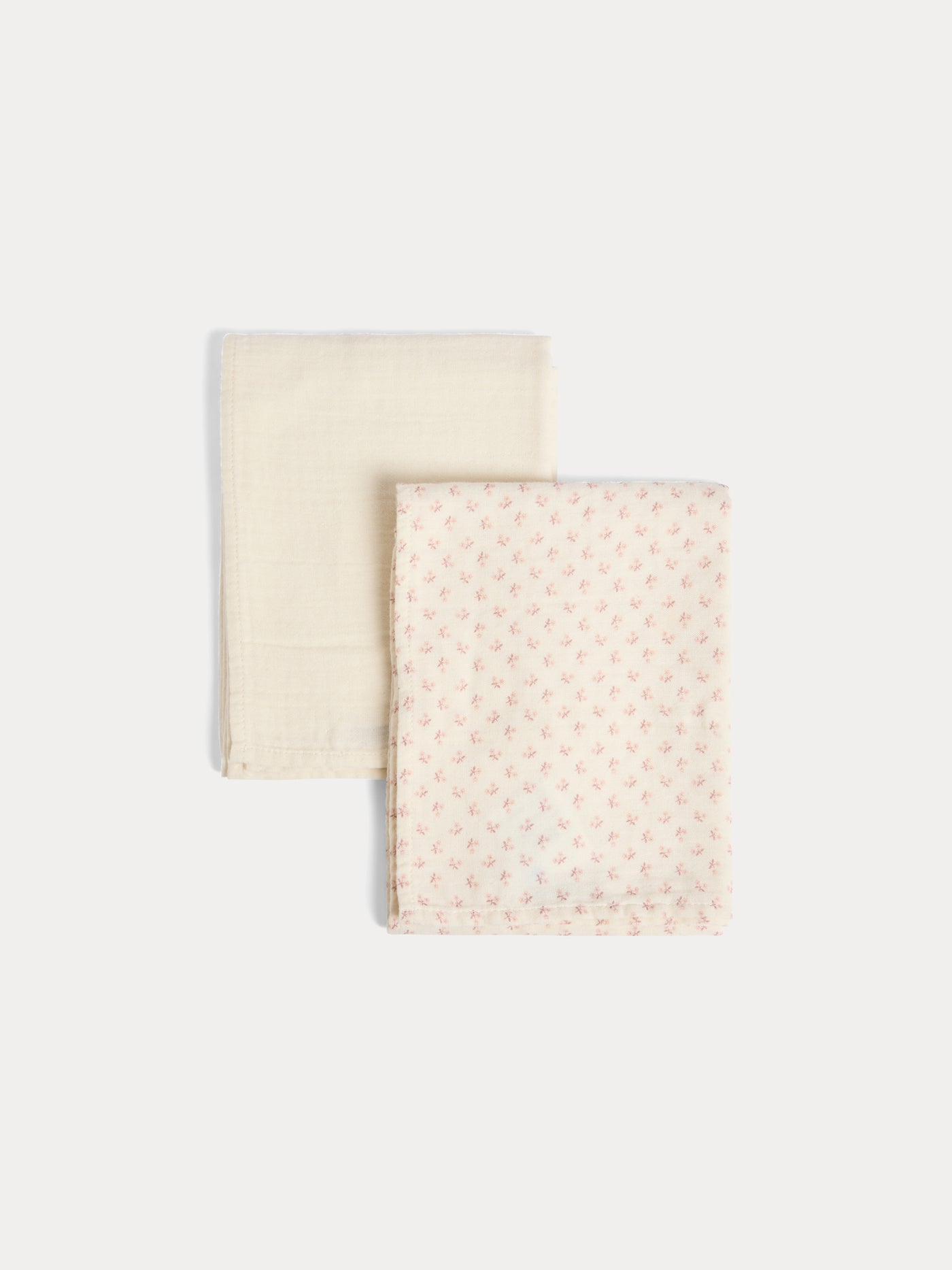 Set of plain and floral print cuddly swaddles in organic cotton