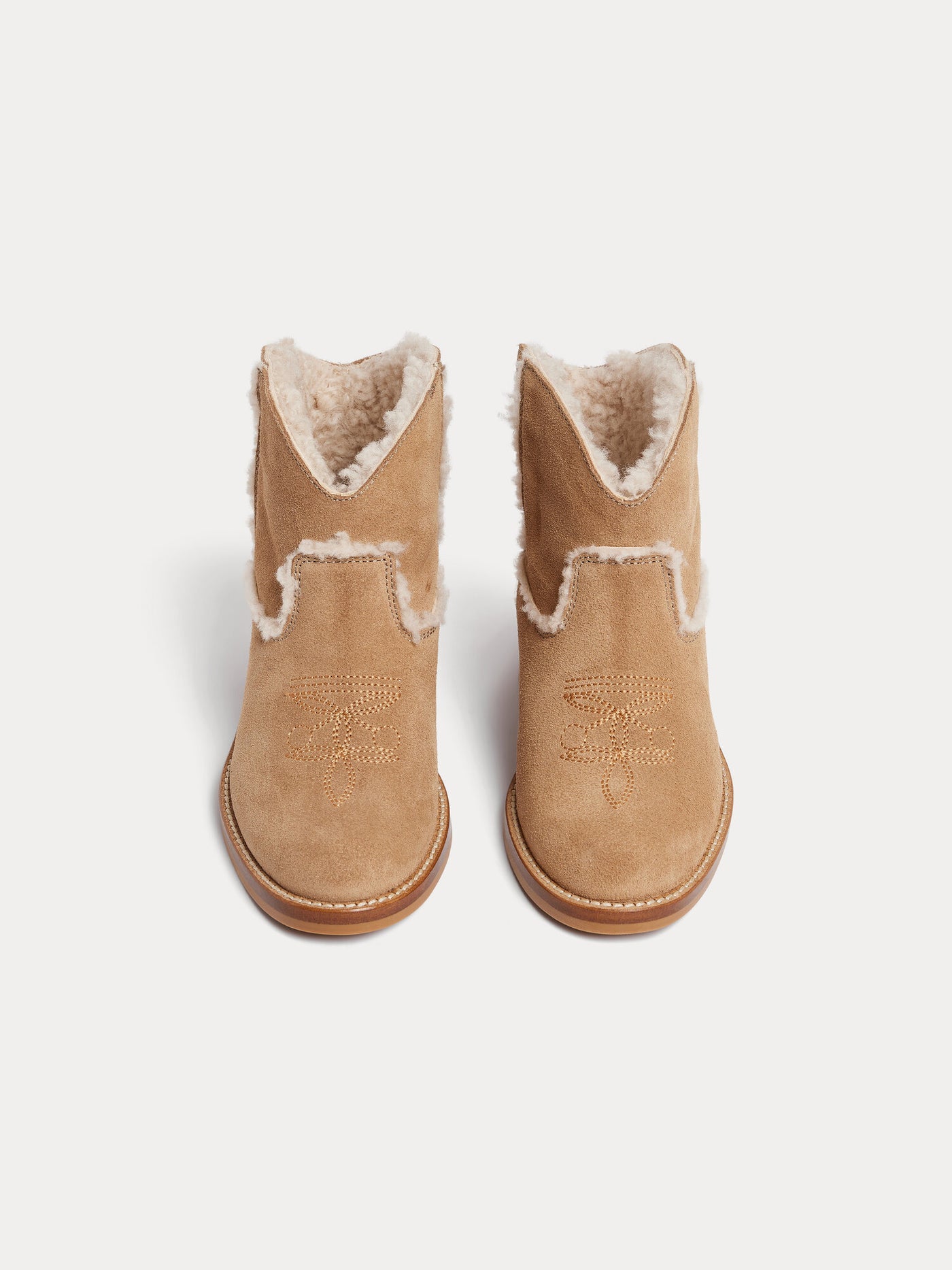 Maysha western boots in leather and faux fur