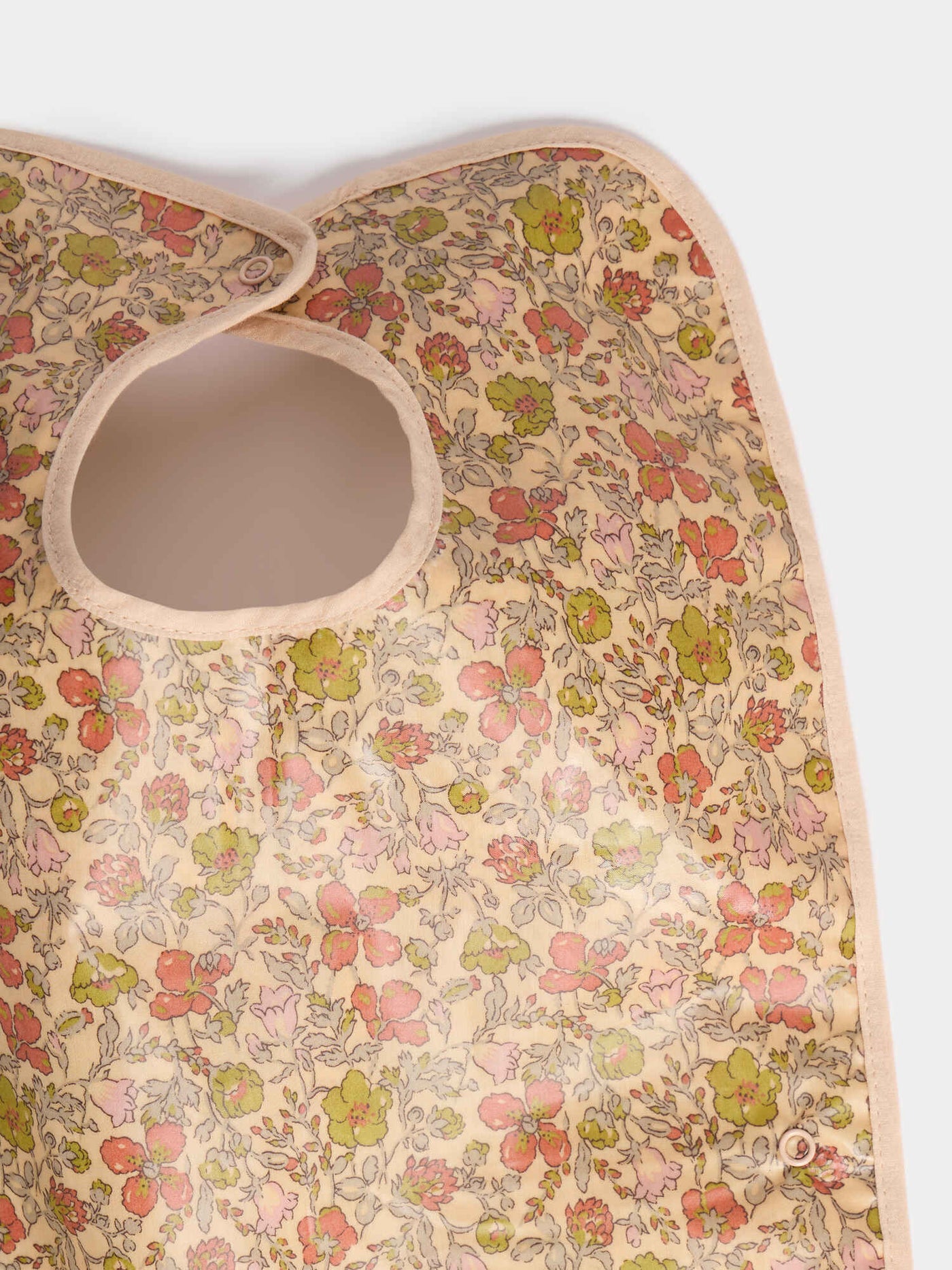 Clip-on bib in yellow Liberty fabric in coated organic cotton