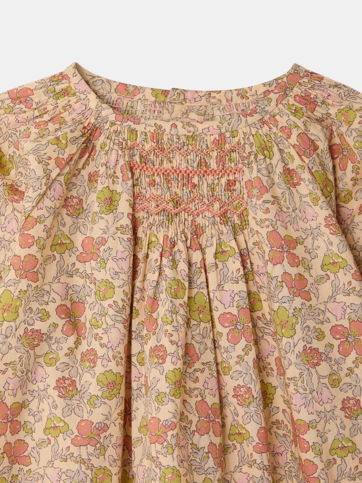 Jia playsuit in smocked and hand-embroidered Liberty organic cotton fabric