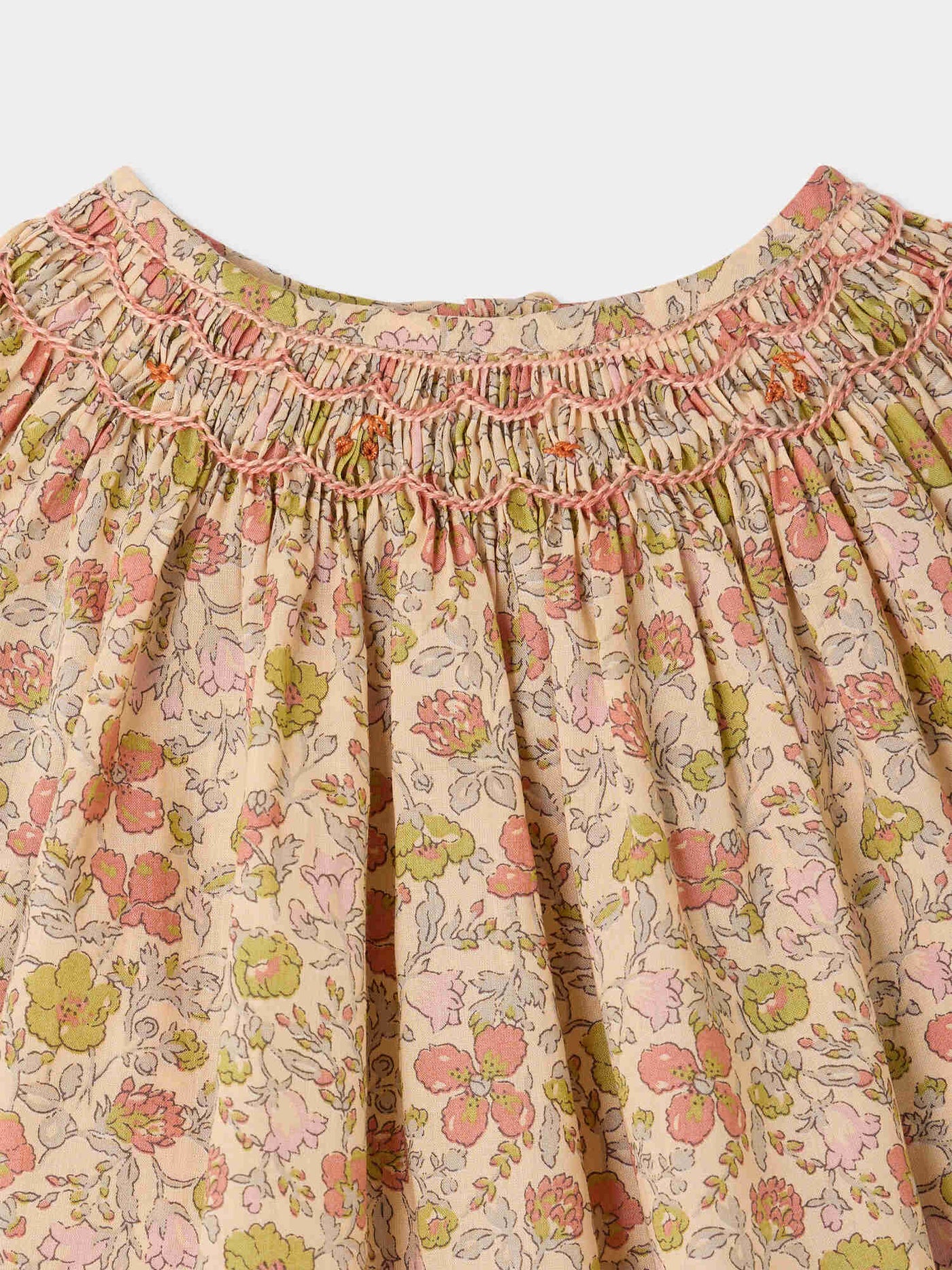 Griotte baby blouse in Liberty fabric smocked and hand-embroidered in organic cotton