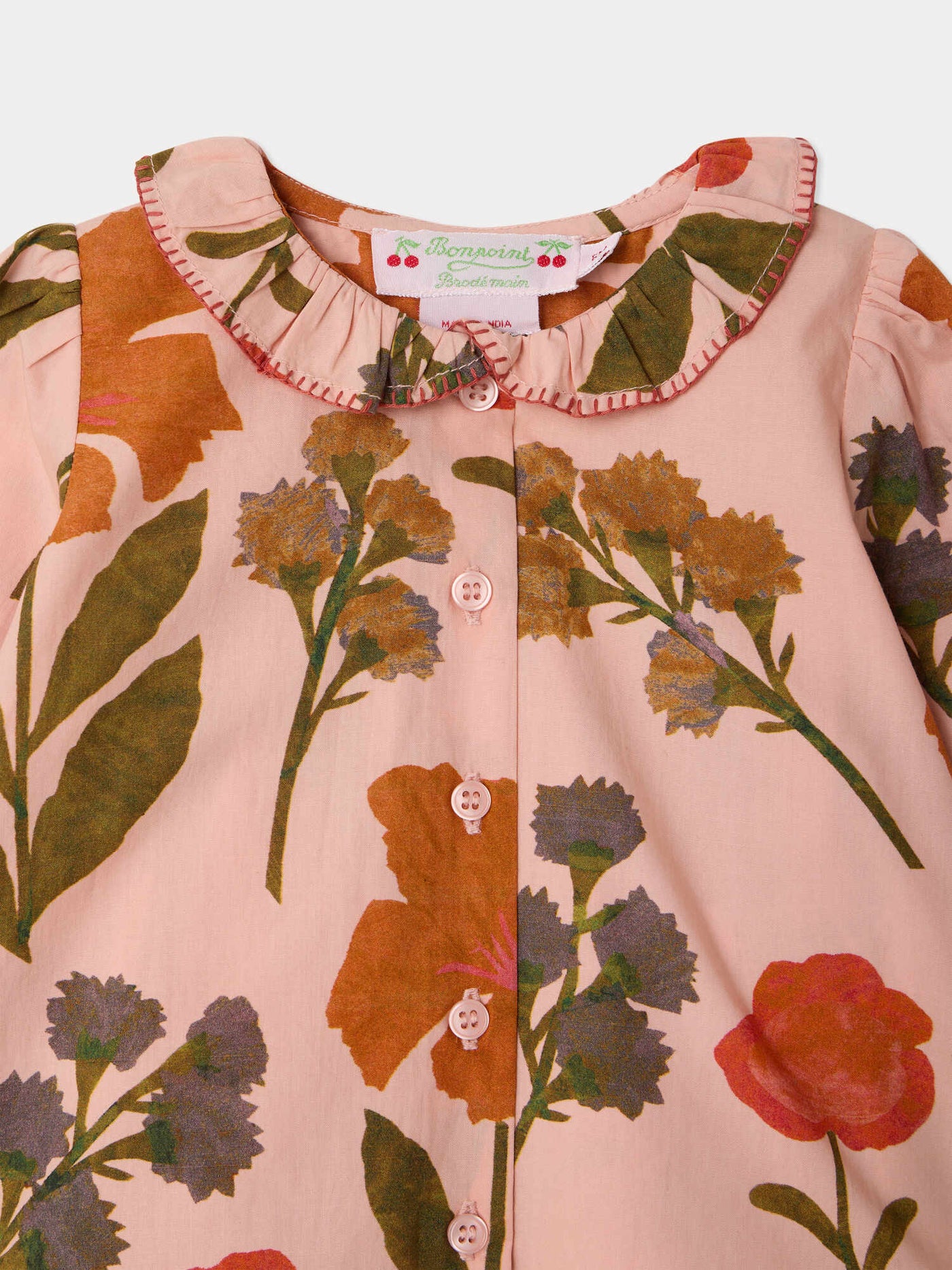 Jojoba baby blouse with hand embroidered collar and organic cotton flower print