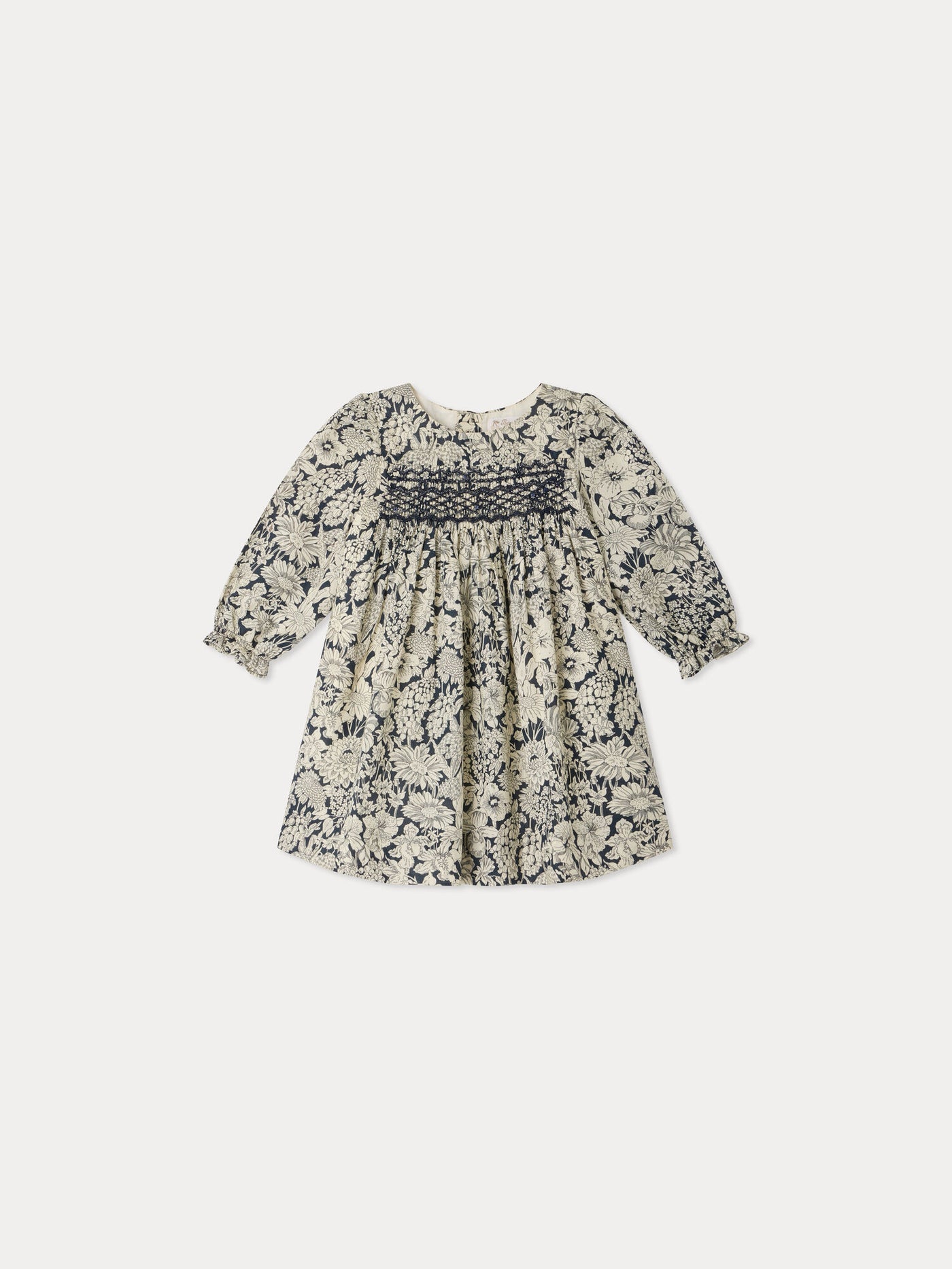 Jailys baby dress in Liberty fabric with smocking and hand embroidery in organic cotton