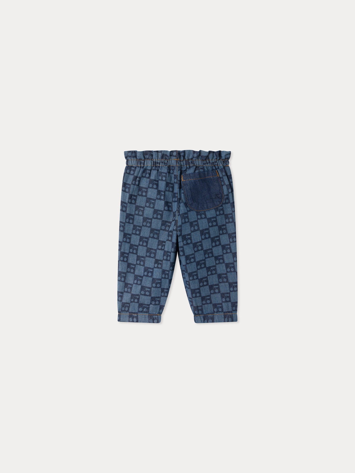 Luciole baby trousers with a cherry chequerboard pattern, made from organic cotton