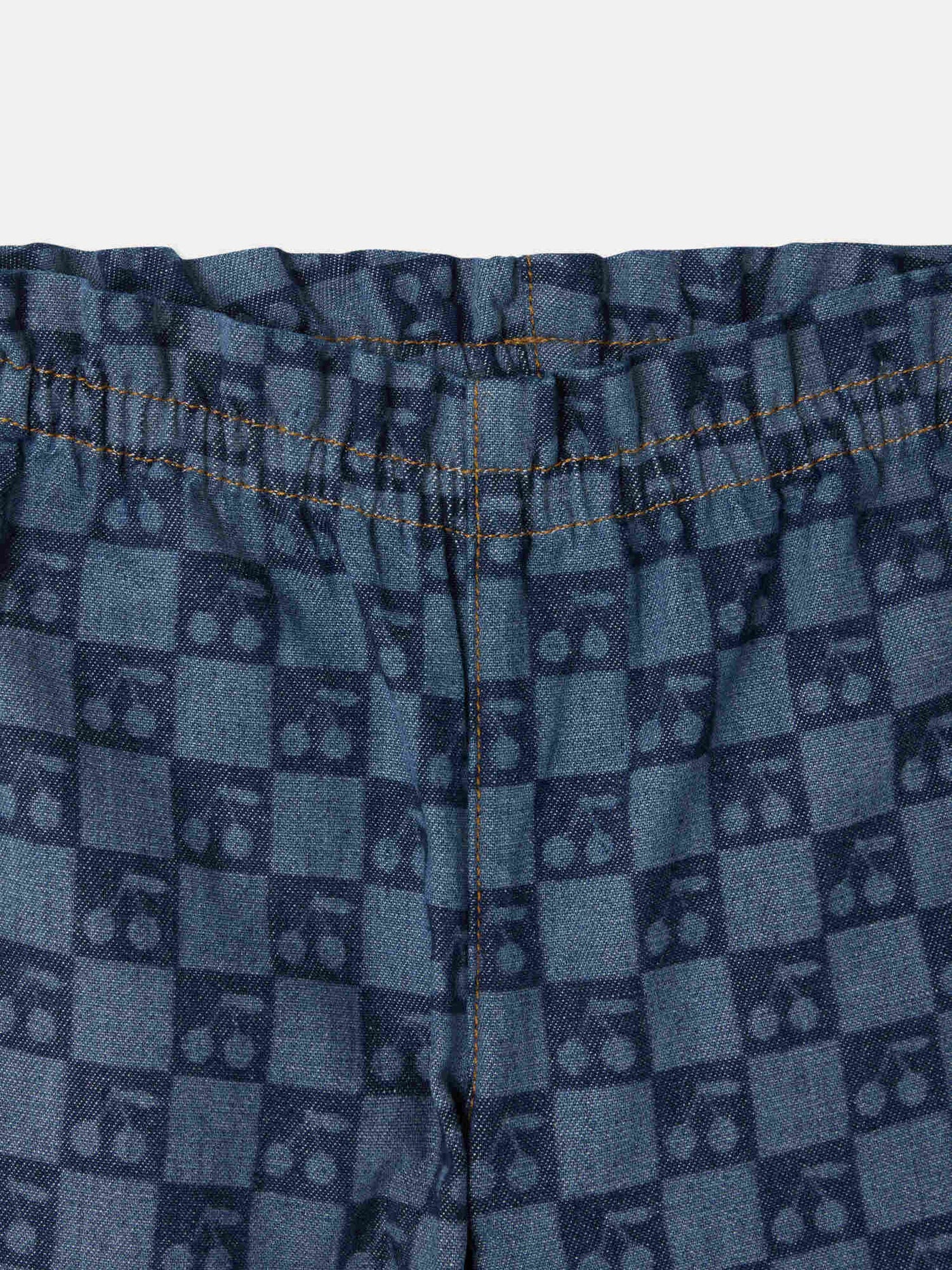 Luciole baby trousers with a cherry chequerboard pattern, made from organic cotton