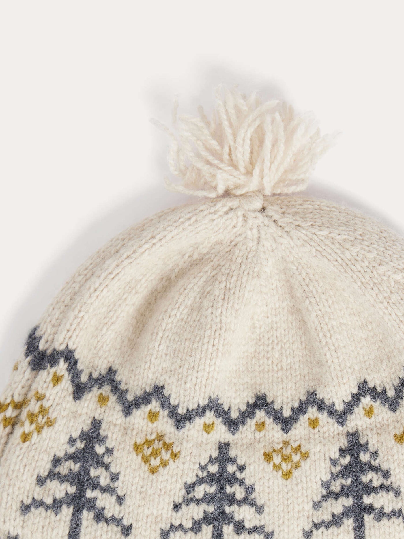 Tinna baby hat in fir-tree jacquard with pompom and drawstrings